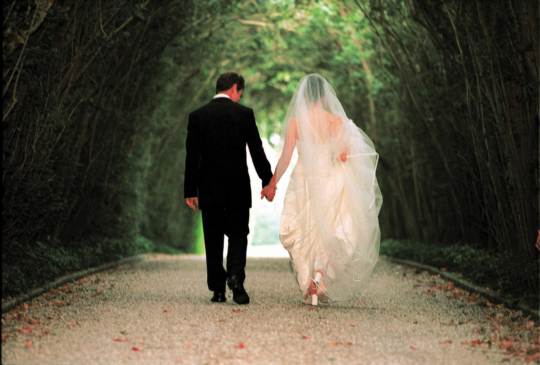 Bride and groom holding hands - planning fights to avoid