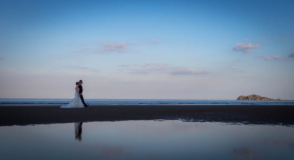 Portmarnock Hotel & Golf Links Beach view with couple